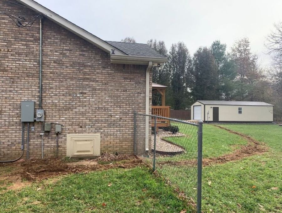 Residential electrical panel upgrade with new trench and sub-feed to an accessory building, wired for receptacles, lighting, and A/C, in White House, TN
